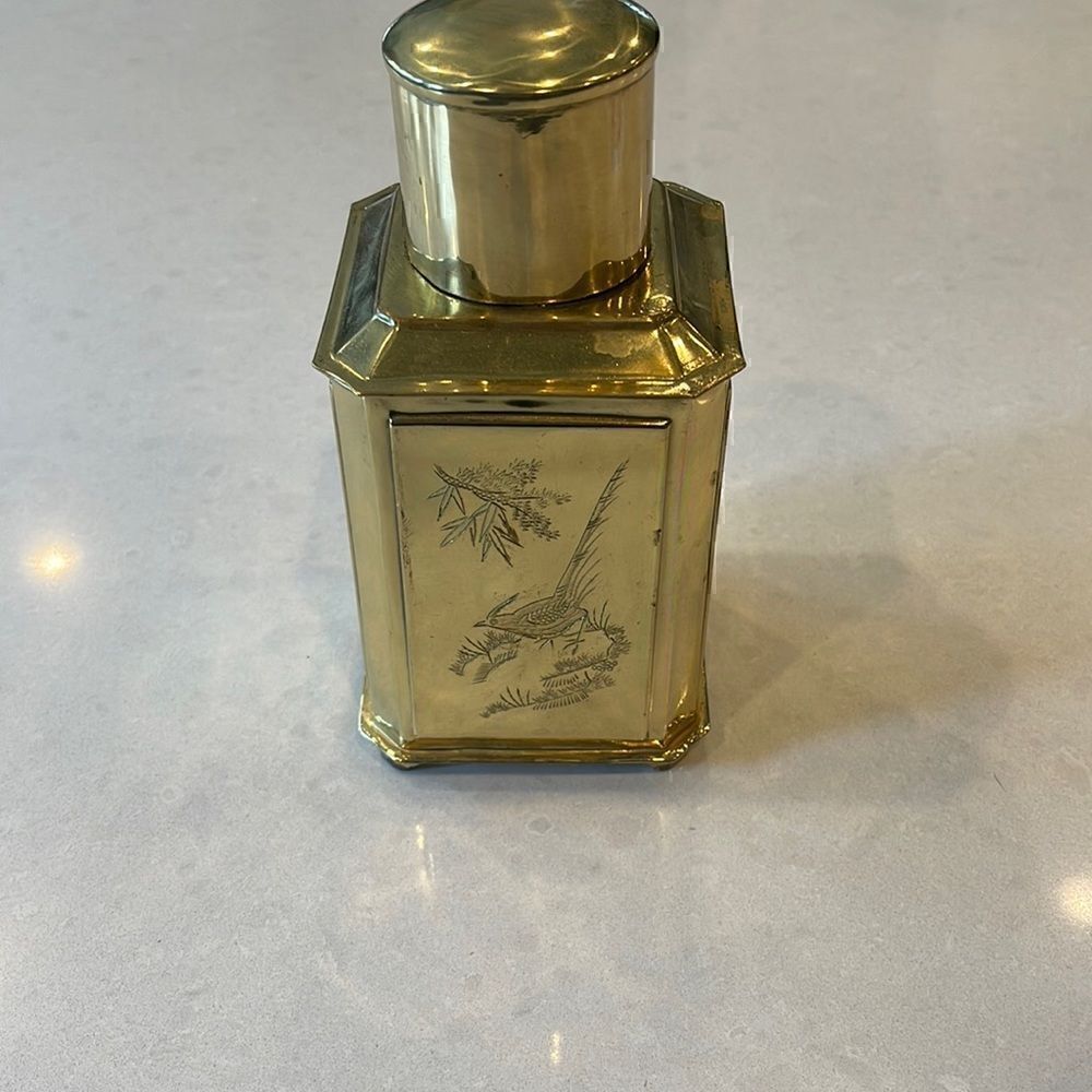 Tea brass vintage container, nice etching on all 4 sides lid fits well.